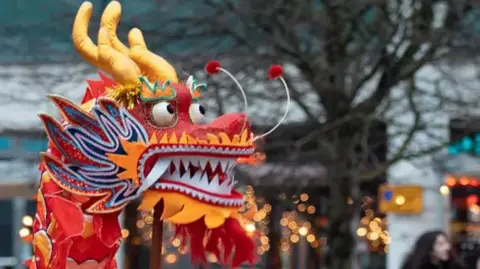 Visit Winchester A dragon head is held aloft during a dance.