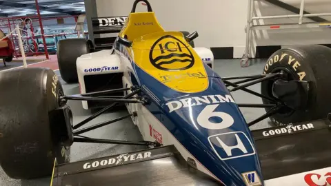 BBC Blue, yellow and white Formula 1 car