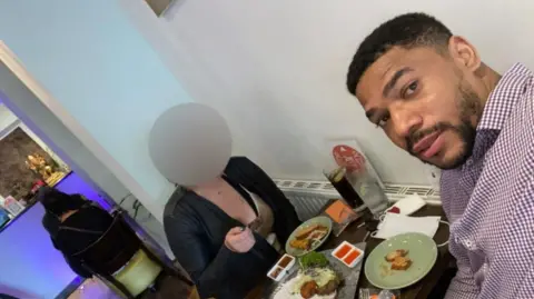 Dimitri Moses A selfie taken by Dimitri Moses while eating a meal with a female friend