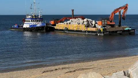 Barges bring rocks which will used to protect the shoreline at Cromer and Mundesley from the sea