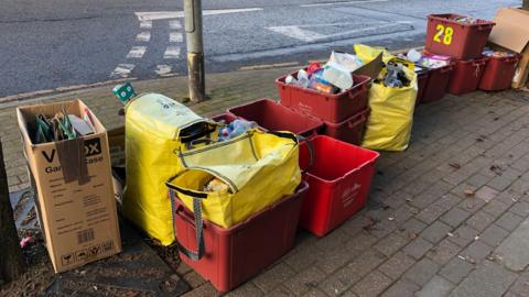 Collection of kerbside recycling containers in Coalville, Leicestershire