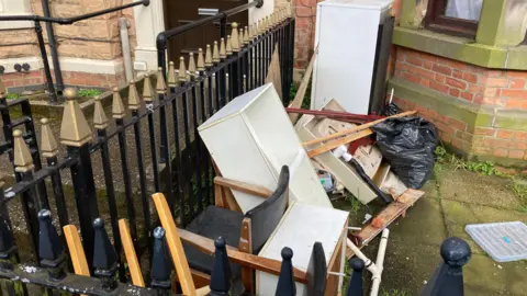 Rubbish outside a house 