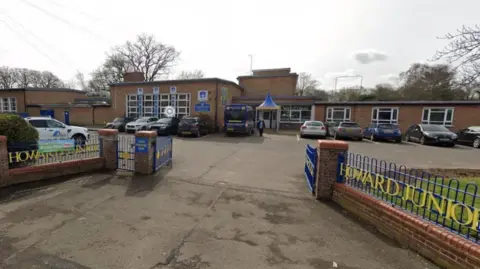 Google View of Howard Junior School gates, car park and main entrance