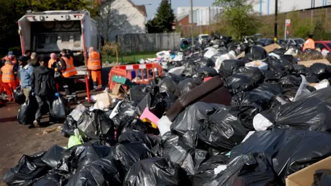 EPA Rubbish is piled high at a drop off point at a community centre in Birmingham, Britain, on 3 April 2025.