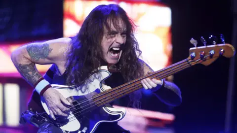 Javier Martín/EPA-EFE/REX/Shutterstock British heavy metal band Iron Maiden's bassist Steve Harris performs in Santiago, Chile, 27 November 2024. More than 60,000 people packed Estadio Nacional for the first of two performances by Iron Maiden, after a five-year absence.