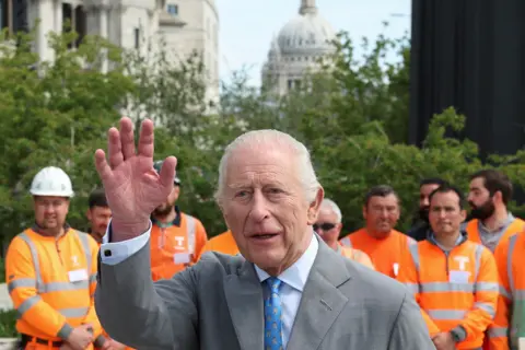 King Charles waving