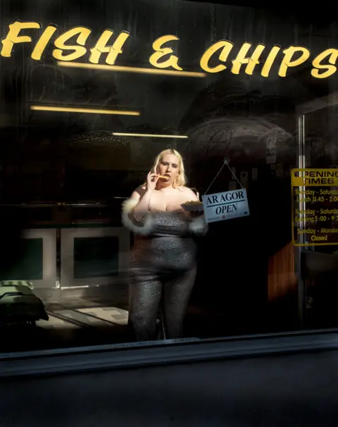 Megan Winstone A photograph of a woman in a fish and chip shop in Abercynon