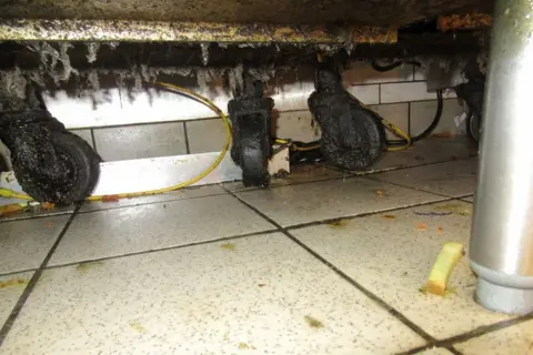 Local Democracy Reporting Service/Waltham Forest Council Grease covers the bottom of a work surface at a KFC in London