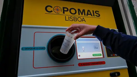 Getty Images A reverse vending machine for plastic cups in Portugal. It has a computer screen which shows the total amount a person is being reimbursed