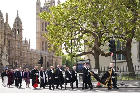 Stefan Rousseau/PA Media Speaker of the House of Commons Sir Lindsay Hoyle (right) walks in procession with MPs and peers from the Palace of Westminster in London to Westminster Abbey for a Service of Thanksgiving on the 80th anniversary of VE Day.