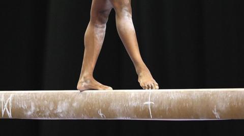 A general view as a competitor competes during the balance beam 