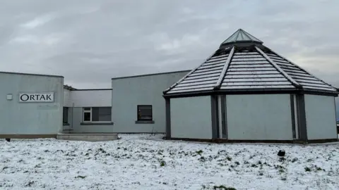 The Ortak jewellery manufacturing premises in Hatston sits covered in snow on a cold, grey day. Goods were stolen from the premises on Monday evening, several of which were found lying outside in the snow.