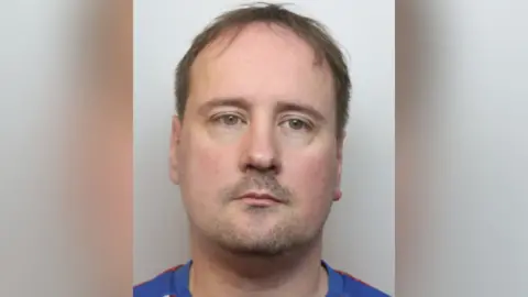 Staffordshire Police A mug shot of Christopher Shepherd