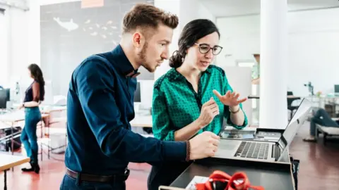 Getty Images Office workers