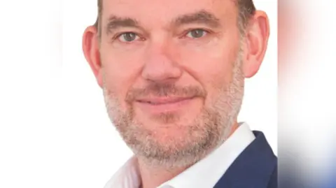 Dr George Findlay, the outgoing CEO of the University Hospitals Sussex NHS Foundation Trust. 