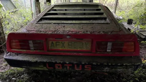 Charterhouse The rear of the vehicle covered in dirt and moss. The registration is still readable.