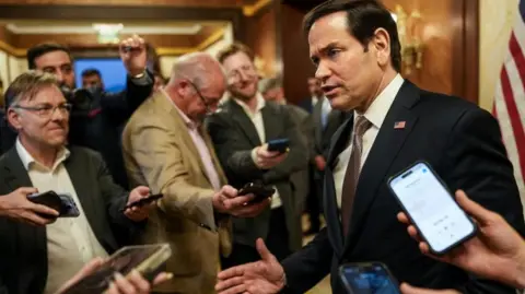 Reuters Marco Rubio surrounded by reporters in Kuwait