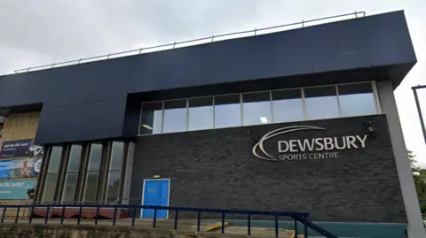 Google An external view of Dewsbury Sports Centre, with its name in large letters on the side of the building