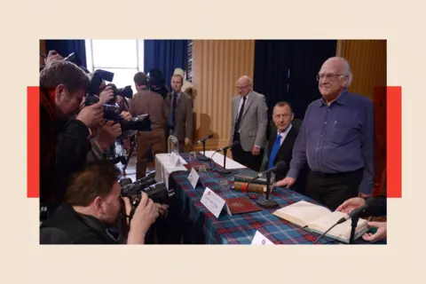 Getty Images Peter Higgs arrives at a press conference before being awarded the Nobel Prize in Physics 