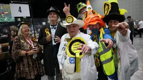 f359d5b0-6bf0-11f1-8631-5f302ec8cd09.jpg Why candidates dress up and run in major UK elections