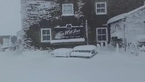 Tan Hill Inn The front of the Tan Hill Inn covered in deep snow