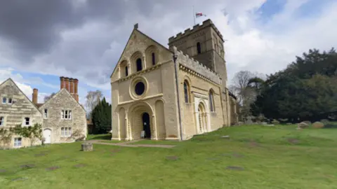 Google Maps Outside St Mary's in Iffley, Oxford, on a cloudy day.