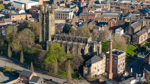 Getty Images Aerial view of tree-lined Wrexham's St Giles Parish Church in the city centre
