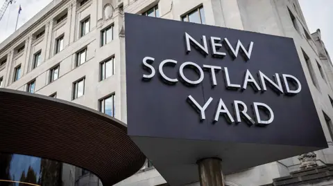 Getty Images The sign outside Met police HQ saying "New Scotland Yard". 