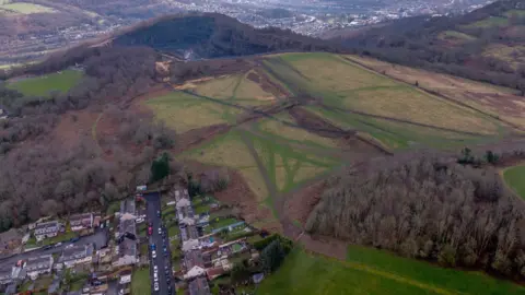 JW Drone Solutions An aerial image of the quarry with houses in the foreground
