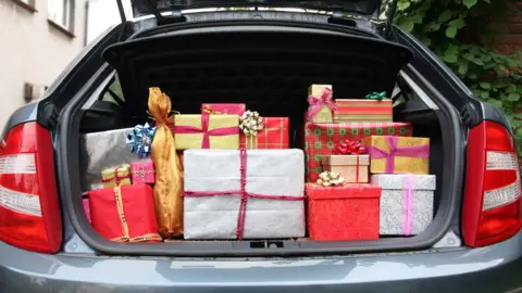 Getty Images A hatchback car with its boot stuffed full of Christmas presents before visiting relatives