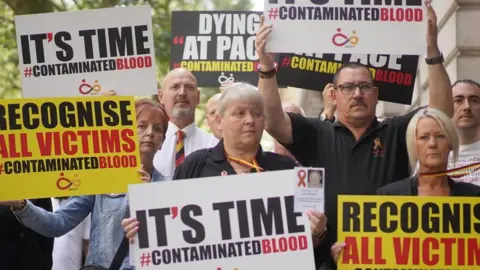 PA Media Campaigners, including many who are personally infected and affected by infected blood, gathering in Westminster, London.