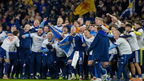The Scotland team celebrating after reaching the World Cup.