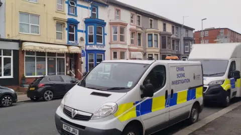 BBC/Paul Burnell CSI van parked across the road from the Garfield Hotel in Springfield Road, Blackpool.