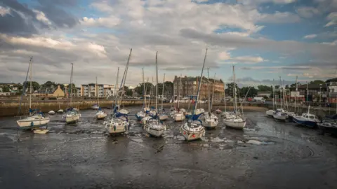 Getty Images Picture of small boats moored in the harbour in Musselburgh, East Lothian