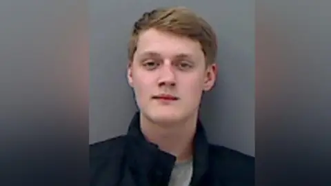 Cleveland Police Mugshot of a young man with blond hair.