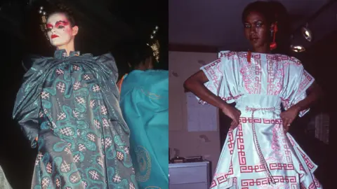 Zandra Rhodes Foundation A model poses in a blue sparkly dress and another poses in a white dress with a red pattern