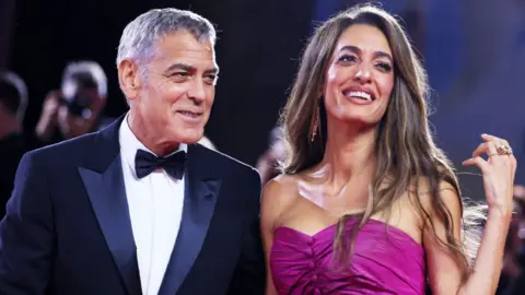 George Clooney film praised as 'midlife crisis masterpiece' 1 Getty Images George Clooney and Amal Clooney attend the "Jay Kelly" red carpet during the 82nd Venice International Film Festival on August 28, 2025 in Venice, Italy