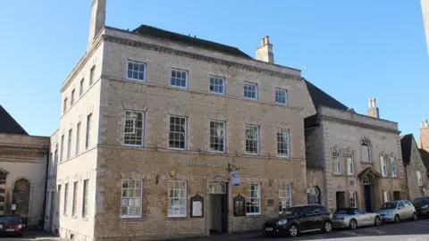 An image of the front of Stamford Arts Centre and neighbouring Stamford Theatre, old brick buildings in the centre of the town.