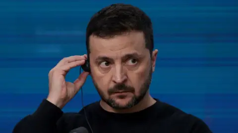 Getty Images A photo of Volodymyr Zelensky at a press conference in Brussels. 