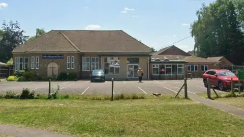 Google A Google Street View of the church, an unassuming one-storey building, except for the cross on the main entrance.