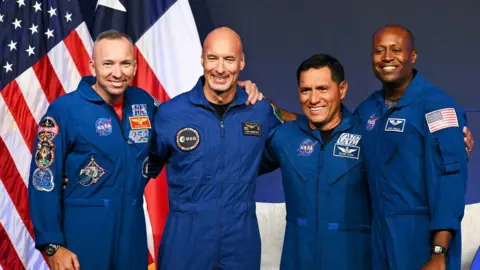 NASA astronaut commander Randy Bresnik, ESA (European Space Agency) astronaut pilot Luca Parmitano, NASA astronaut mission specialist Frank Rubio, and NASA astronaut mission specialist Andre Douglas speak during a press conference announcing the crew for the Artemis III mission at NASA's Johnson Space Center in Houston, Texas, on June 9, 2026.