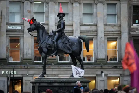 Getty Images A statue of the Duke of Wellington riding a horse in Glasgow city centre - both man and horse have traffic cones on their heads