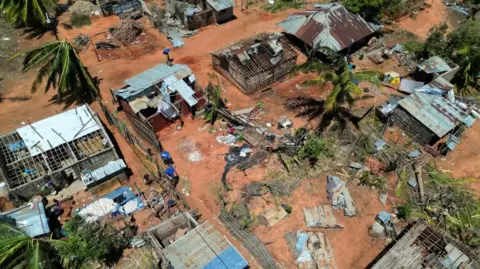 Reuters A drone view of destroyed houses and buildings following cyclone Chido in Pemba, Mozambique on 18 December