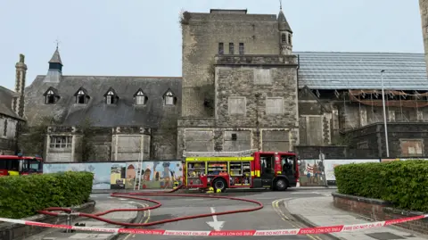 BBC A fire engine outside the derelict Mechanics' Institute in Swindon.