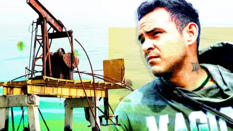 A designed image of a old rusty oil pump on the left and a young man with dark hair on the right. He is looking wistfully into the distance. He is wearing a grey hoodie with magic written on it in white and green letters.