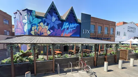 Google Maps The exterior of Lux nightclub in Belfast. It features a colourful mural with the words 