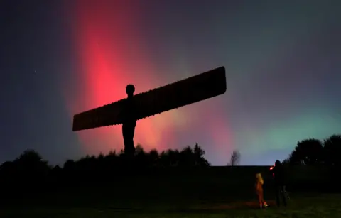 Reuters Angel of the North in Gateshead with Northern Lights behind