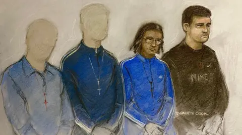 PA Media A court sketch image showing Tolliver on the right wearing a black Nike hoodie. He has short brown hair and a forlorn expression. Next to him is Wescott wearing a blue tracksuit, wearing glasses and his hair in twisted braids. On the left there are two teenagers wearing blue long-sleeved shirts with their faces blank to anonymise them.