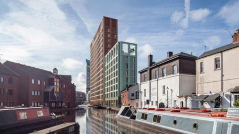 A visualisation of what the development could look like, with tall buildings dominating hte skyline next to the canal