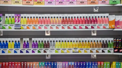Getty Images Rows of brightly-coloured vape boxes.